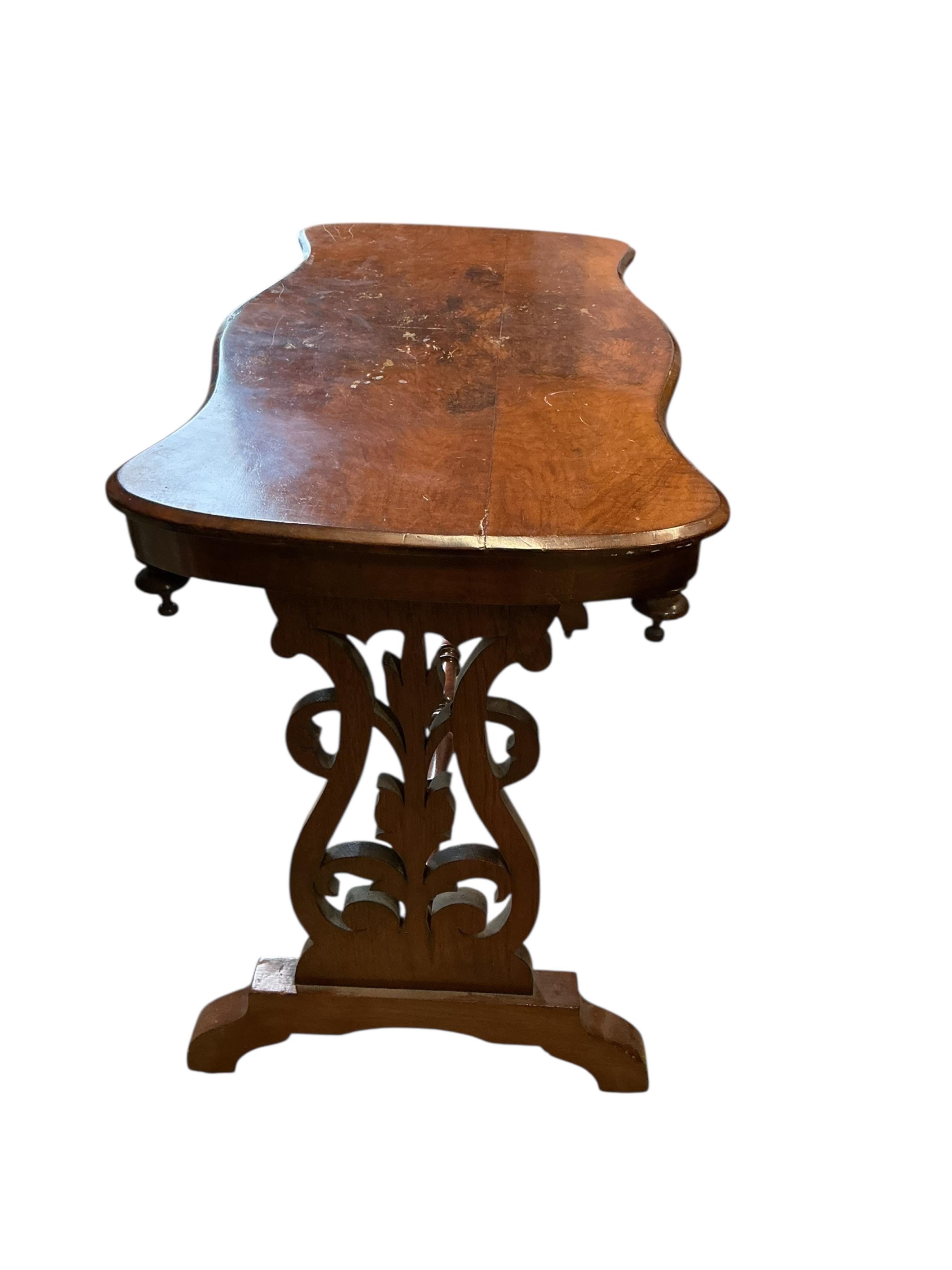 A Victorian walnut serpentine centre table, width 104cm, depth 51cm, height 73cm